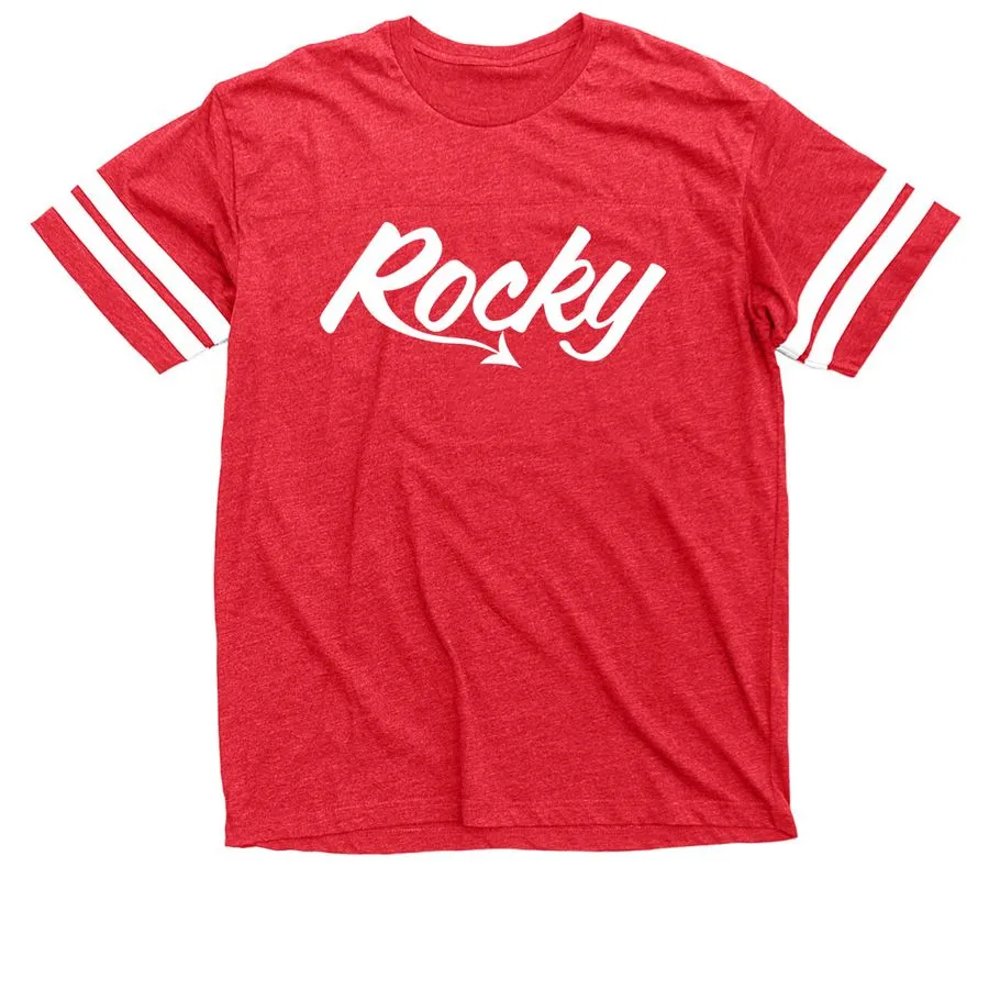 A photo of a red tee shirt with a white Rocky logo on the front and white rings around the arms